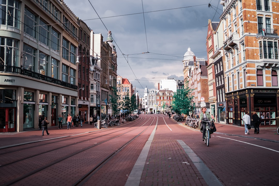 A street in amsterdam with buildings and bikes.