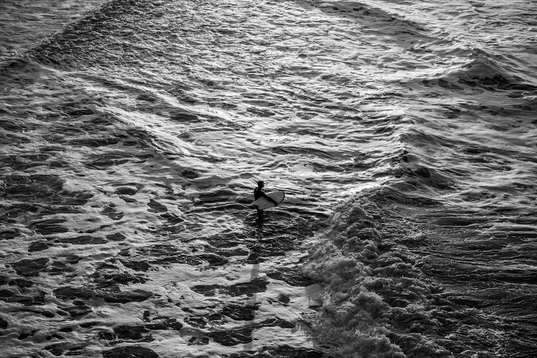 man surfing photograph