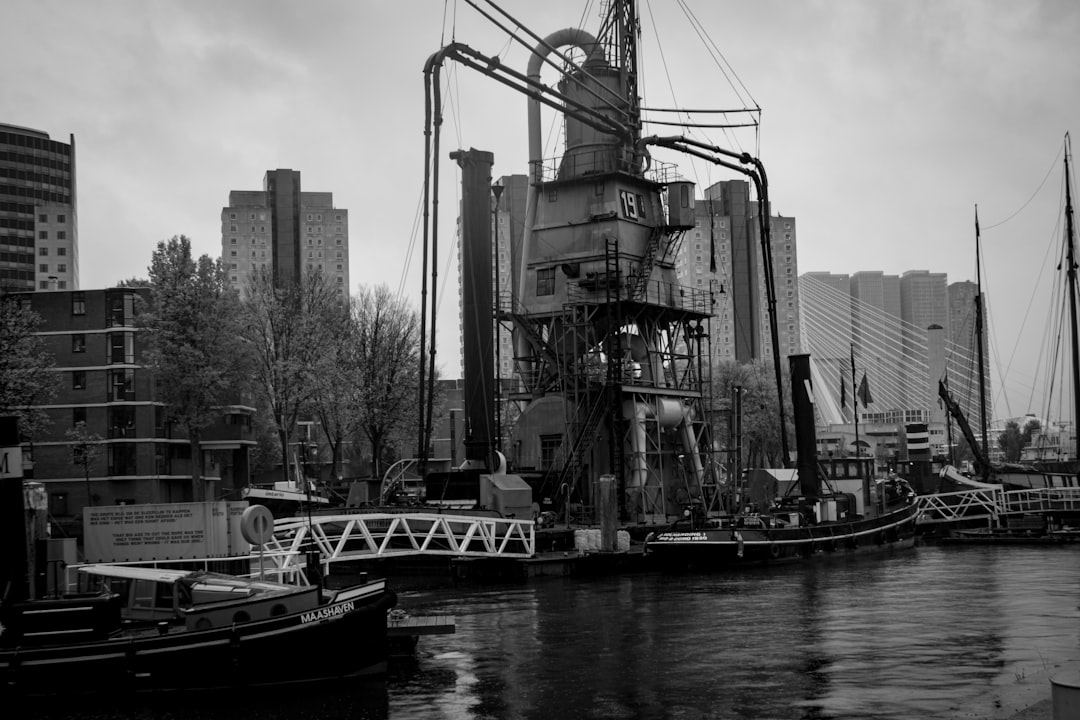 brown metal structure beside body of water