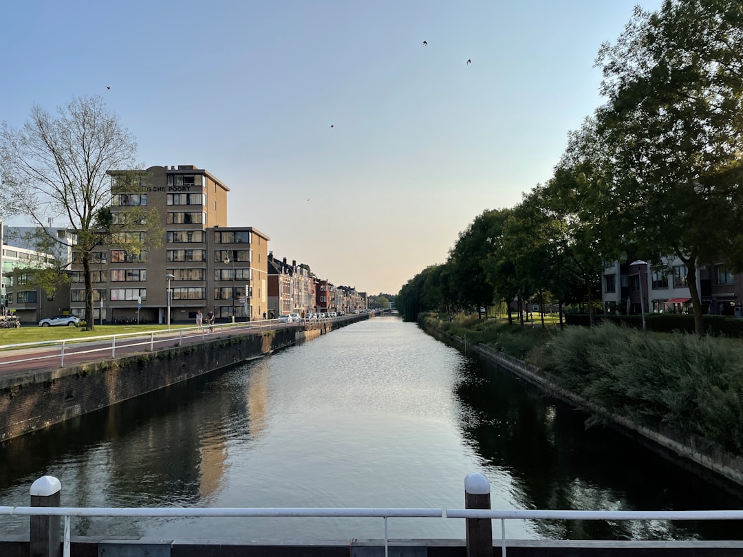 a river running through a city next to tall buildings